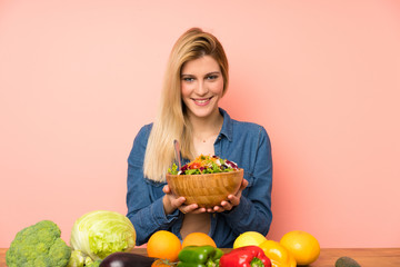 Wall Mural - Young blonde woman with salad