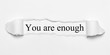 You are enough on white torn paper