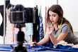 © Elnur - Young beautiful female tailor recording video for her blog