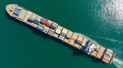 Canvas Print - Cargo container in factory harbor at industrial estate for import export around in the world, Trade Port / Shipping - cargo to harbor. Aerial view of sea freight, Cargo ship,