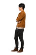 © luismolinero - A full-length shot of a Asian man with brown jacket in lateral position over isolated white background