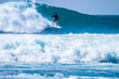 © Daniel - teenager surfing at the wave in tenerife playa de las americas - red wetsuits and beautiful and perfect wave