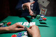 © Ilnur - professional poker game. Green poker table with two games. poker player folds by throwing cards on the table