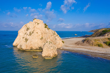 Cyprus. Aphrodite rock. Petra tou Romiou. The bay of Aphrodite coast. Mediterranean sea. Seascape. Paphos. Kouklia.  Sightseeing In Cyprus. Coast of the Republic of Cyprus. Turquoise water.