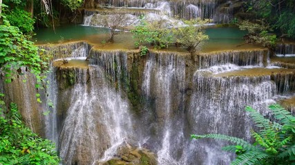 Wall Mural - Waterfall flow standing with forest enviroment high angle view in thailand called Huay or Huai mae khamin in Kanchanaburi province, Thailand., Lockdown.