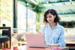 © FS-Stock - young and beautiful girl with notebook and laptop sitting in a cafe
