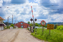 Open Railway Barrier With Road Signs In A Small Village In Ukraine