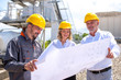 © Drpixel - Group of engineers on site, visiting ready mix concrete plant and discussing construction plan