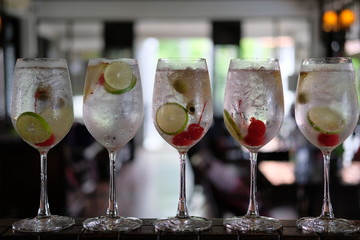 Wall Mural - summer drinks of gin tonic alcoholic cocktails on table