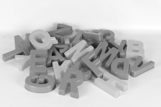 black and white of a heap from large letters