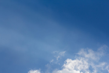 Wall Mural - sun beams or sun rays light on blue sky with white cloud.