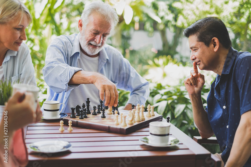Cuadros en Lienzo Senior old man playing chess game on chess board for strategy and planning conce