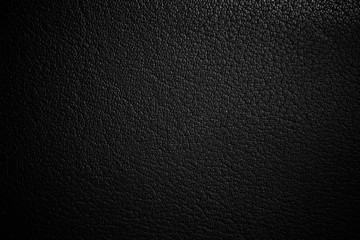 black paper texture or background with spotlight, dark tone 