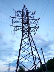 Electricity pylon against a blue evening sky