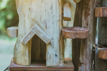 Hand made wooden bird house nest  in public Park , hand wood shelter for birds .