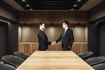 Sticker - Businessmen shaking hands in meeting room