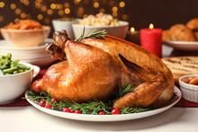 Traditional Festive Dinner With Delicious Roasted Turkey Served On Table
