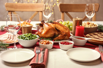 Traditional festive dinner with delicious roasted turkey served on table