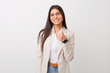 © Asier - Young business arab woman isolated against a white background smiling and raising thumb up
