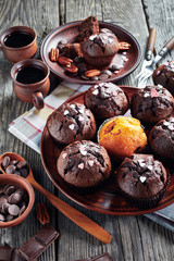 Wall Mural - chocolate pecan muffins on a clay plate