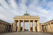 Front view of the famous neoclassical Brandenburg Gate (Brandenburger Tor) in Berlin, Germany, on a sunny day.