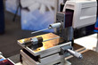 Surface Roughness Tester, profilometer. A device for measuring roughness on flat surfaces, in grooves, indentations and on curved surfaces. - Image