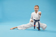 © serhiibobyk - Karate girl standing in stance and training punching.