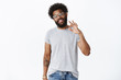 © Cookie Studio - No worries, chill it okay. Portrait of carefree confident and assured handsome african american bearded man in glasses showing ok gesture as confirming plan perfect, agree and giving positive opinion