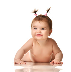 Wall Mural - Infant child baby girl lying naked in diaper happy smiling laughing isolated on a white