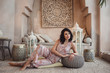 Woman posing in traditional morrocan living room