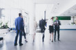 © alotofpeople - Businesspeople walking in corridor