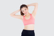 © NT_studio - Beautiful portrait young asian woman standing stretch muscle arm isolated on white background, girl wear sport clothes exercise and yoga for health, wellness concept.