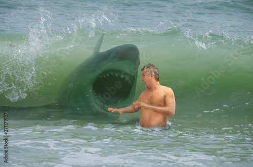 Cuadros en Lienzo Frightened swimmer man getting hit by wave with attacking shark
