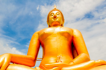 Big Golden Buddha with blue sky blue at Wat Muang, Ang Thong Province, Thailand