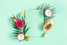 Summer Composition. Tropical Palm Leaves, Fruits, Paper Blank On Mint Green Background. Summer Concept. Flat Lay, Top View, Copy Space