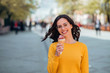 © bnenin - Portrait of a student girl eating ice cream outdoors.