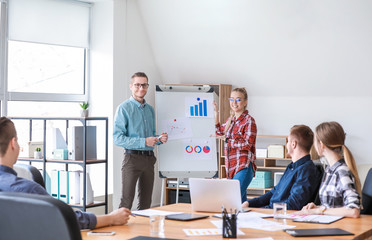 Wall Mural - Group of young people at business meeting in office