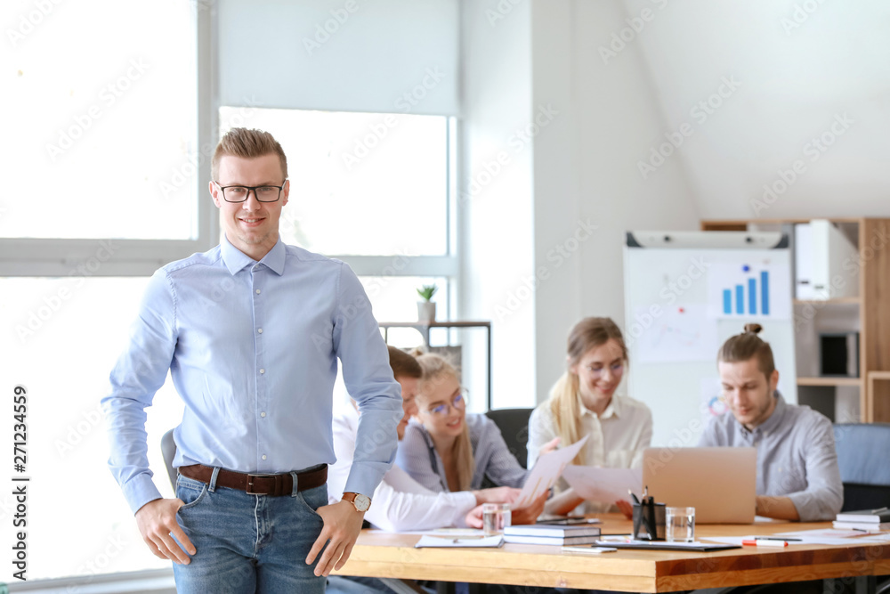 Young businessman at meeting in office