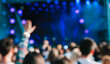 © alekseyliss - Crowd at concert. Blurred and defocused
