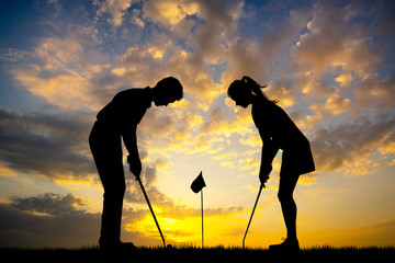 Wall Mural - man teaches woman to play golf