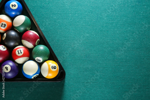 Fotografía Billiard balls in triangle rack on table
