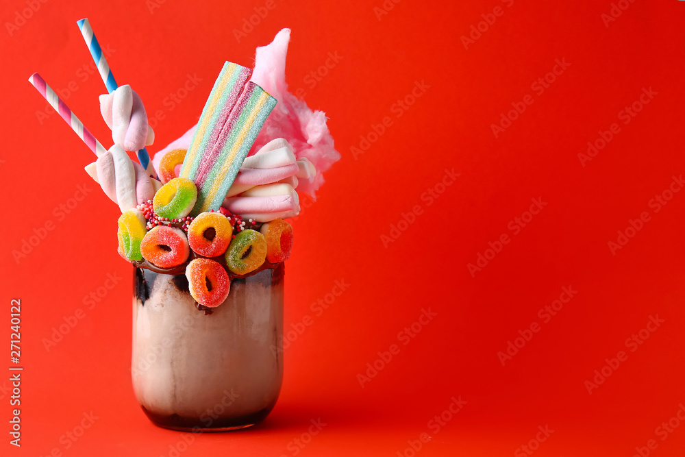 Delicious freak shake on color background