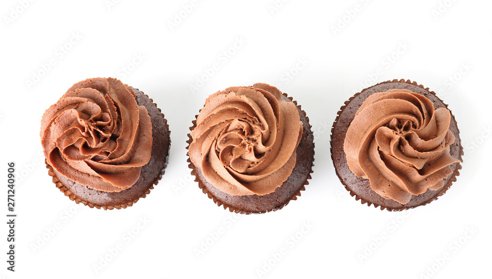 Tasty chocolate cupcakes on white background