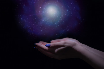 Wall Mural - Magic light in palm, stardust and magic in your hands, stars and space