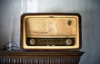 very old east european yellow brown wooden am FM radio on the shelf