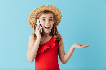 Cheerful little girl wearing swimsuit standing