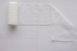 © vachcameraman - Roll gauze with fold on white background