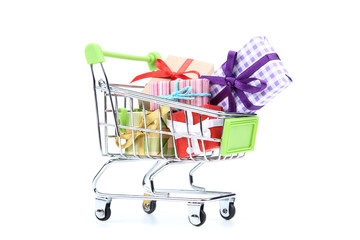 Wall Mural - Small shopping cart with gift boxes isolated on white background