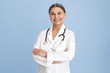 © shurkin_son - Isolated studio image of charismatic beautiful Caucasian senior female chief doctor crossing arms on her chest confidently and smiling broadly dressed in white overall with stethoscope around her neck