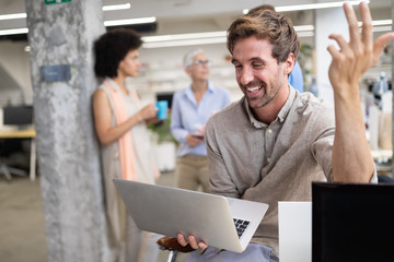 Sticker - Happy young coworker man working in office